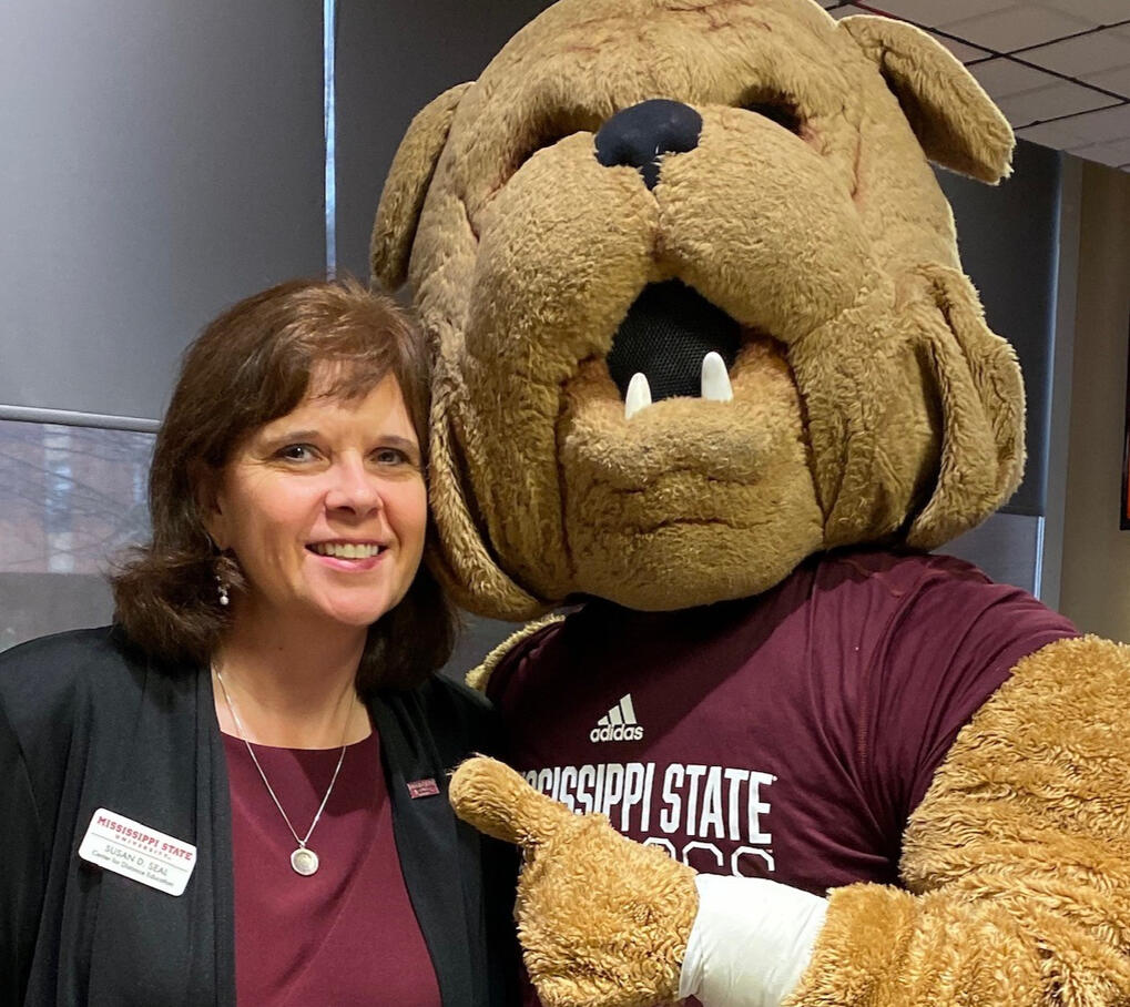 Image of host Susan Seal with Mississippi State University's mascot.